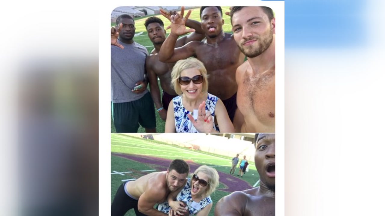 Mom poses with hunky students during daughter's college dropoff